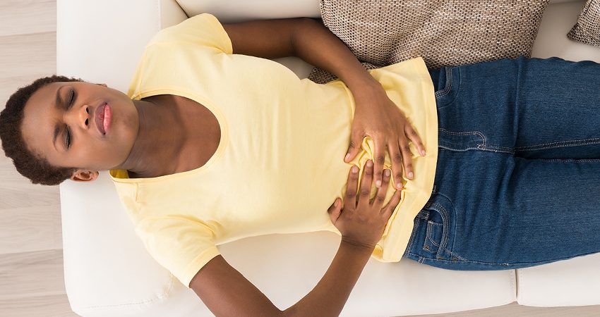 Stock image of a woman holding her stock with both hands